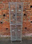 A BANK OF FOUR LOCKING CAGES / LOCKERS