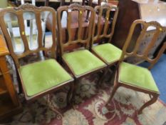 A SET OF FOUR FRENCH STYLE OAK CHAIRS
