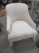 A MODERN CREAM SUEDE EFFECT ARMCHAIR