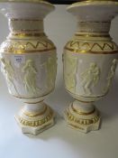 A PAIR OF CERAMIC VASES WITH GRECO STYLE RELIEF DECORATION