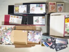 THREE ALBUMS OF FIRST DAY COVERS, together with three boxes of loose stamps and loose sleeves of