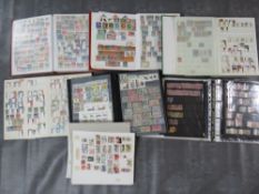 SEVEN STAMP ALBUM / STOCKBOOKS, containing mostly foreign stamps