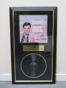 A MOUNTED ELVIS PRESLEY HARUM SCARUM RCA VICTOR VINYL RECORD AND RECORD SLEEVE, signed by Elvis