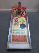 A VINTAGE HAND PAINTED FAIRGROUND WINNING NUMBER CANE BOARD, with revolving score board with central