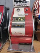 A VINTAGE 'COOPER STAR' ONE ARMED BANDIT, three reel machine, with spare mechanism, with light box