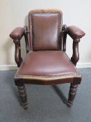 A LATE VICTORIAN BARBERS / DENTISTS CHAIR, with upholstered mahogany frame, with reclining back rest