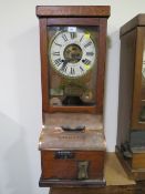 A NATIONAL TIME RECORDER OAK CASED CLOCKING IN CLOCK, with visible clock movement, H 88 cm