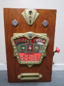 A VINTAGE GOLDEN ZWOLF (12) WOOD CASED WALL MOUNTED ONE ARM BANDIT ARCADE MACHINE, working on