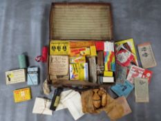 A SMALL LEATHER CASE FULL OF VINTAGE MAGIC TRICKS