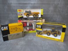 FIVE BOXED DIE CAST VEHICLES, to include 1:50 scale CAT 980G wheel loader, 1:50 scale Bell B40D