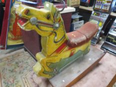 A FAIRGROUND PAINTED WOODEN CAROUSEL HORSE, with polychrome decoration, on later wood rocker, base L