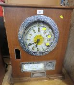 A VINTAGE BRYANS 12 WIN CLOCK PENNY SLOT MACHINE A/F, oak cased, H 59 cm, W 46.5 cm, D 24.5 cm