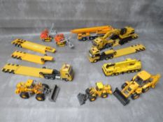 TEN UNBOXED CRANES, TRACTORS, DIGGERS AND HEAVY HAULAGE, various makes to include Conrad,