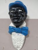 A VINTAGE FIBREGLASS TYPE GENTLEMAN WALL BUST, wearing a blue bowler type hat, H 56 cm