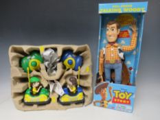 A DISNEY TOY STORY PULL STRING TALKING WOODY IN ORIGINAL BOX, together with a pair of remote control