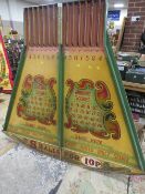 A MID 20TH CENTURY PAINTED WOOD FAIRGROUND ROLL A BALL GAME BOARD, mainly in green and yellow, 145