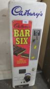 A VINTAGE 'CADBURY'S BAR SIX' WALL MOUNTED VENDING MACHINE, (20p, insert 2 x 10p)