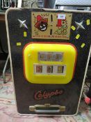 A VINTAGE CALYPSO 1D WALL MOUNTED THREE REEL ONE ARM BANDIT