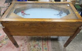 A VINTAGE 'R & W' ICE HOCKEY GAME, of mainly wood construction, with glaze top, fitted with coin