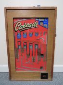 A BELL FRUIT 'CASCADE' WALL MOUNTED ARCADE PENNY SLOT MACHINE, wooden case with glazed front, W 48