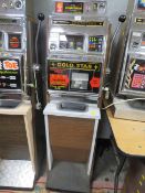 A VINTAGE ARISTOCRAT GROSVENOR ONE ARMED BANDIT, gold star machine with origianl foot board, H 144