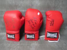 THREE SIGNED BOXING GLOVES, to include Amir Khan, Michael Watson and John Conteh