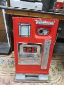 A VINTAGE MILLS DELUXE ID ONE ARMED BANDIT, three reel machine, with red painted front, H 68 cm