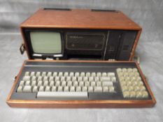 AN EARLY SC84 TYPE PORTABLE COMPUTER, housed in wooden case A/F