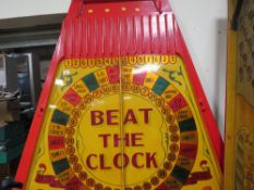 A MID 20TH CENTURY PAINTED WOOD FAIRGROUND ROLL A BALL GAME BOARD, mainly in red and yellow, 144