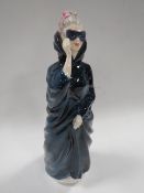 A ROYAL DOULTON FIGURINE 
