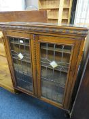 A VINTAGE OAK LEADED / GLAZED BOOKCASE - W 88 CM