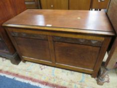 AN OAK PANELLED COFFER