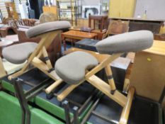 TWO RETRO KNEELING STOOLS