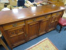 A LARGE OAK EDWARDIAN SIDEBOARD