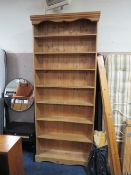 A TALL HONEY PINE OPEN BOOKCASE - 240 X 106 CM