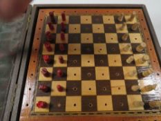 A VINTAGE TRAVELLING CHESS SET MARKED JAQUES LONDON
