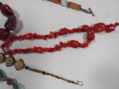 A BAG OF COSTUME JEWELLERY