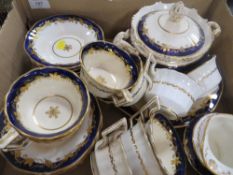A TRAY OF BLUE AND GILT TEA WARE