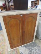 A VINTAGE PINE TWO DOOR CABINET