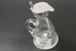 A HALLMARKED SILVER TOPPED TODDY TOGETHER WITH A HALLMARKED SILVER WHISKY LABEL