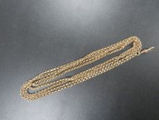 A VICTORIAN ROLLED GOLD MUFF/LONG CHAIN - 54
