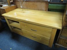A LARGE LIGHT OAK MEDIA CABINET