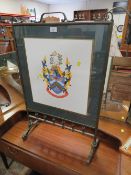 A BRASS FRAMED FIRESCREEN