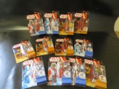 TWELVE CARDED STAR WARS FIGURES