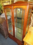 A MODERN GLAZED BOOKCASE