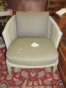 A MODERN OUTDOOR PATIO ARMCHAIR