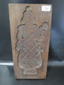 A VINTAGE WOODEN BOOK PRESS WITH THE IMAGE OF A CLOWN