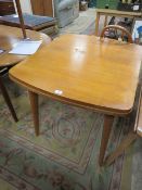 A VINTAGE DRAWLEAF DINING TABLE