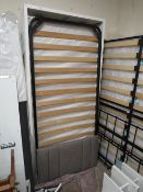 A MODERN SINGLE BED FRAME WITH MATTRESS AND HEADBOARD