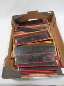 A SMALL TRAY OF 19TH CENTURY MAGIC LANTERN SLIDES